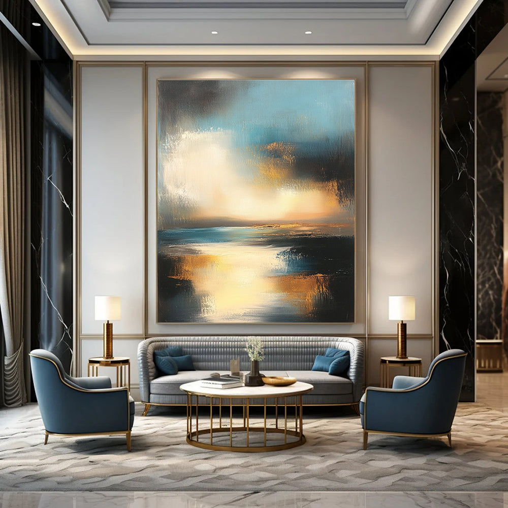 Large abstract oil painting depicting the ocean and sky at sunset with muted colors and gold accents for a serene ambiance.STSC196