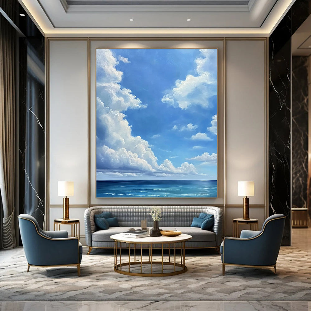 A large abstract painting featuring a blue sky with white clouds and a vast ocean below in a minimalist oil painting style.STSC923