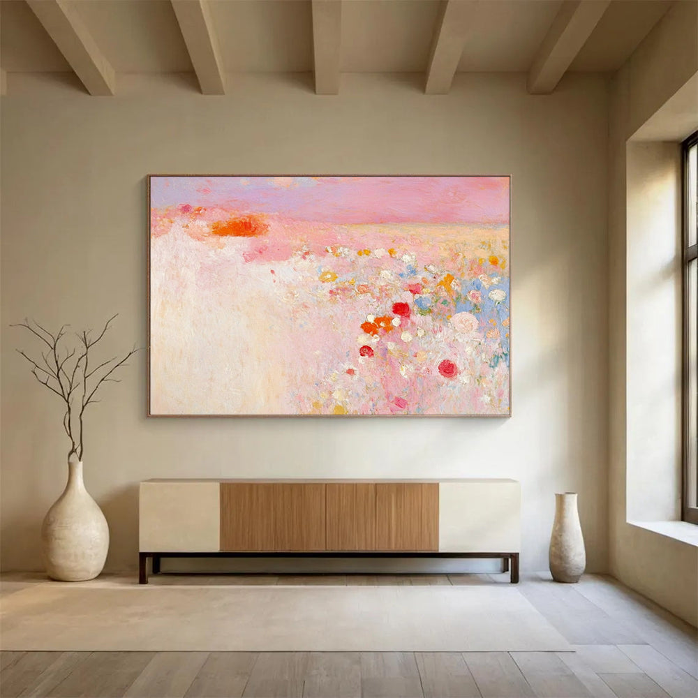 Large abstract painting in soft pink and white with hints of red and yellow evokes springtime calmness amidst a blooming field.SC350