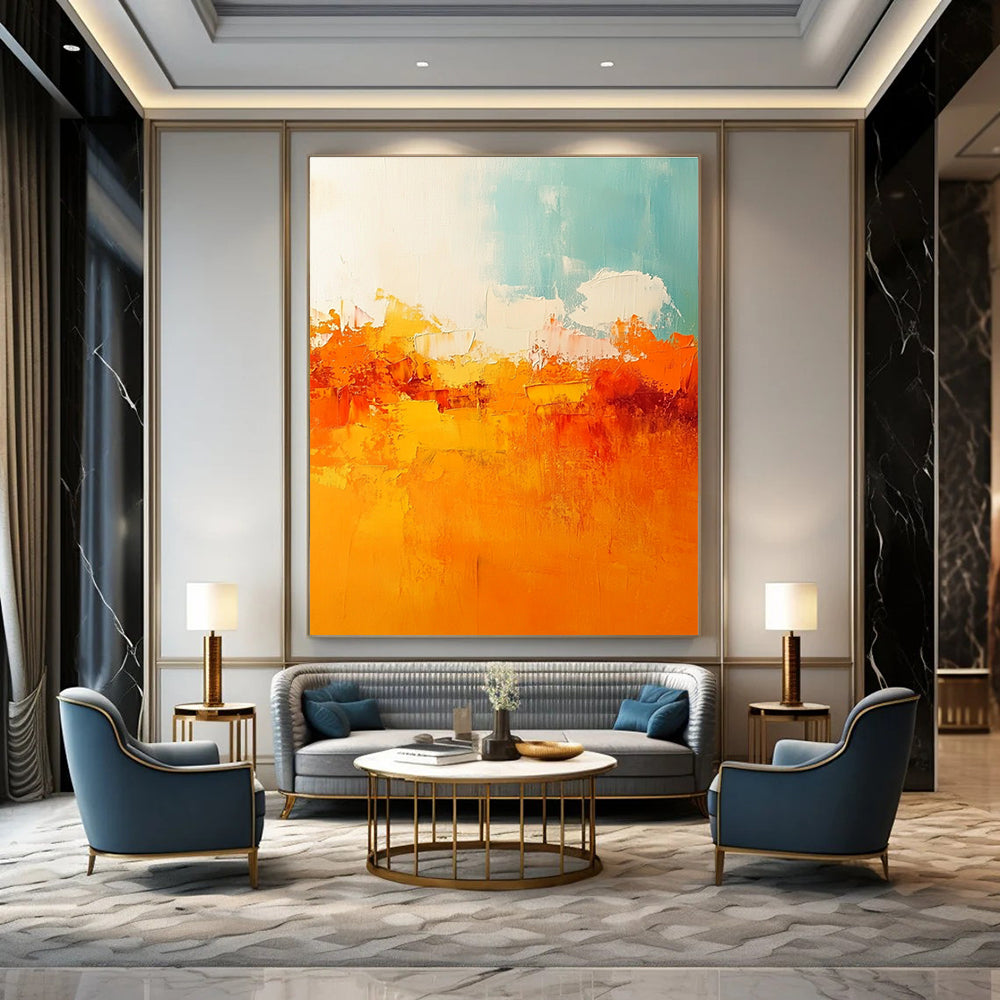 Large abstract painting featuring warm tones of orange and yellow with soft edges and brushstrokes depicting a serene sunset sky.STSC119
