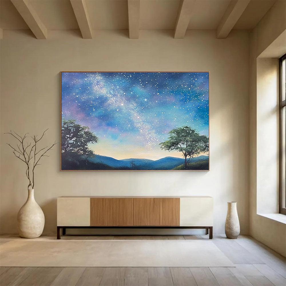 A large abstract painting featuring a serene starry sky with the Milky Way, silhouetted trees on hills, and a fantasy-inspired azure background.SC421