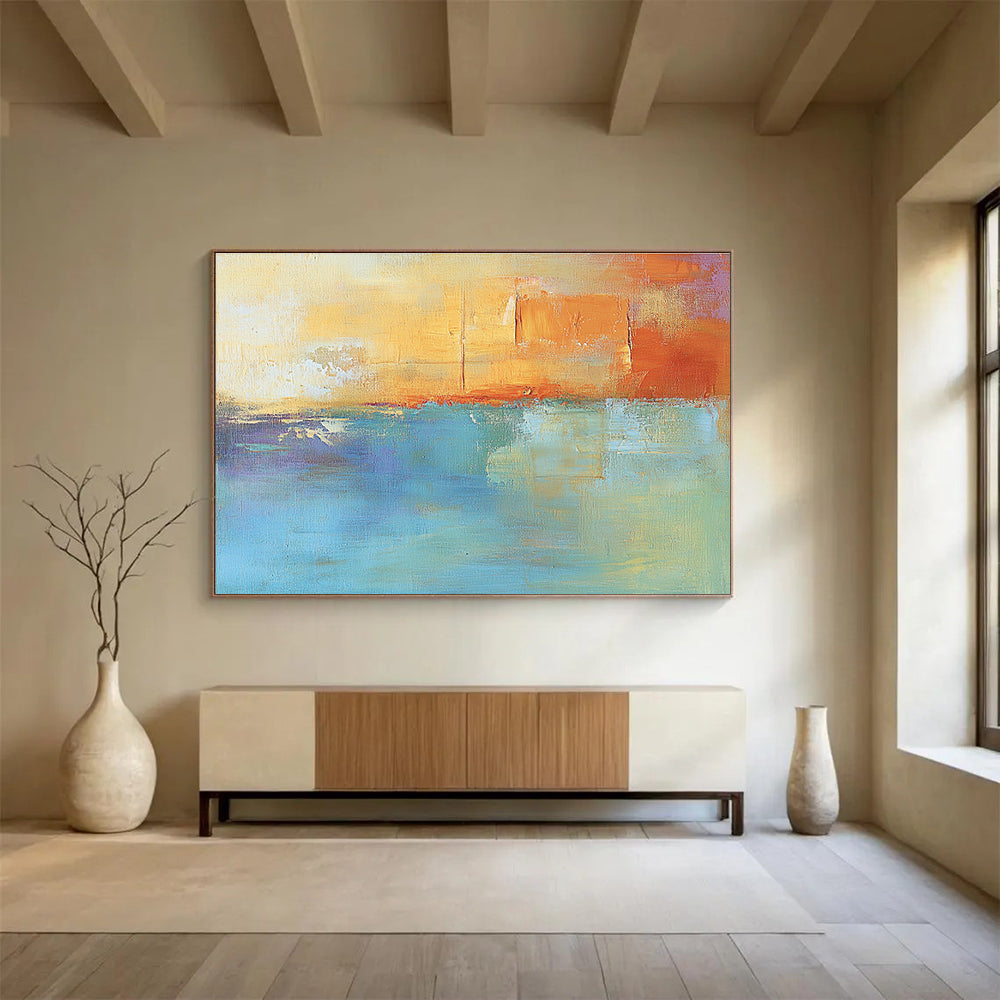 Large abstract oil painting in muted orange and aqua with soft shapes and blurred edges evoking calmness and tranquility through its impressionist style.SC124