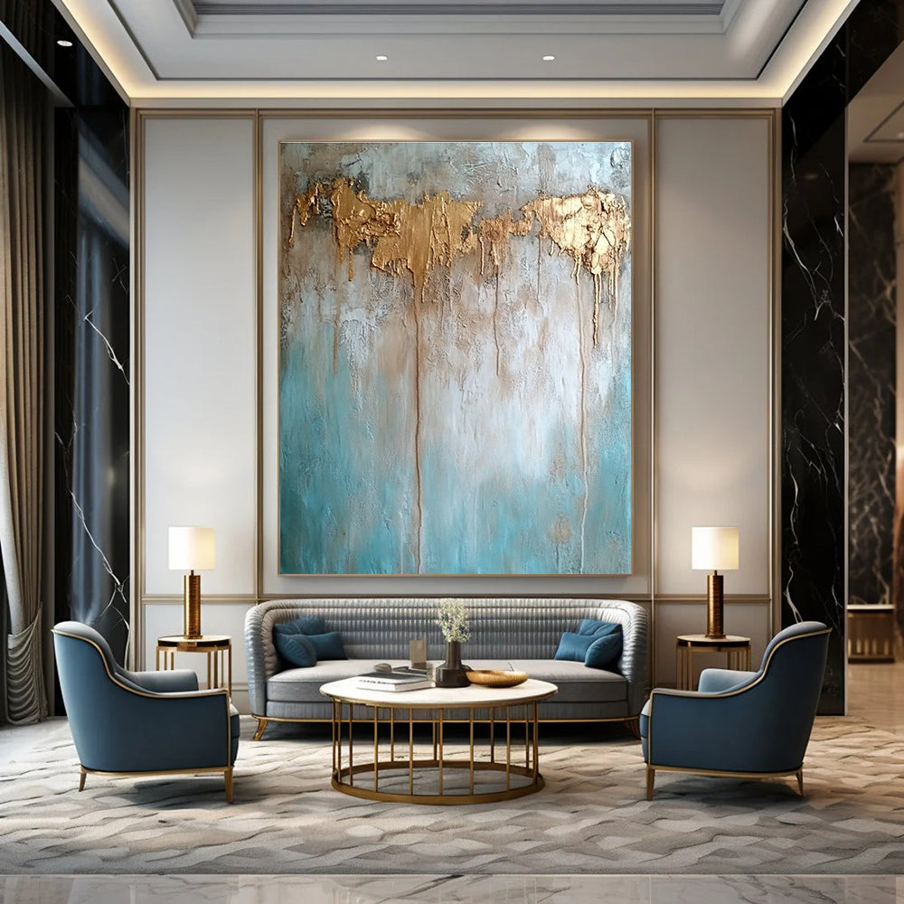 Large abstract painting with texture in neutral tones featuring light blue brown and gold hues highlighting water damage elements against a concrete wood background.STSC136