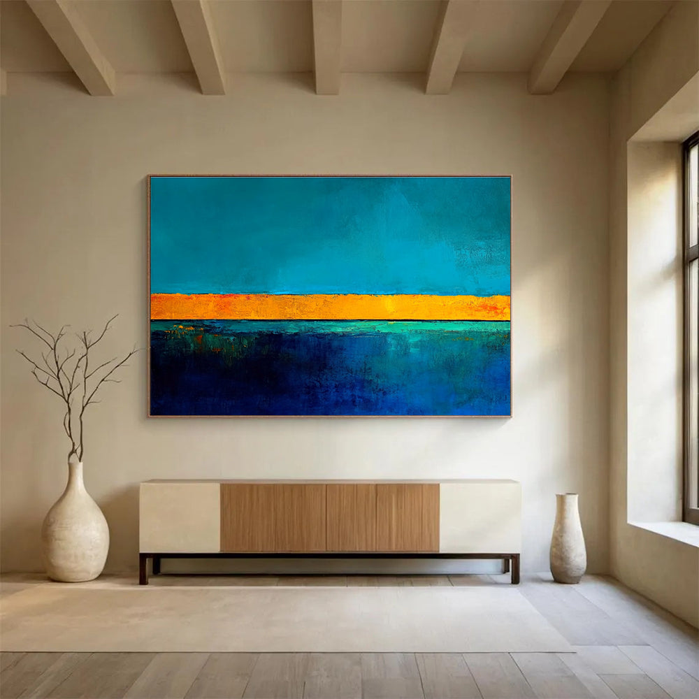 Large abstract painting featuring bold blue and yellow contrasts with a tranquil turquoise base and gold lines inspiring serenity and calmness.SC492