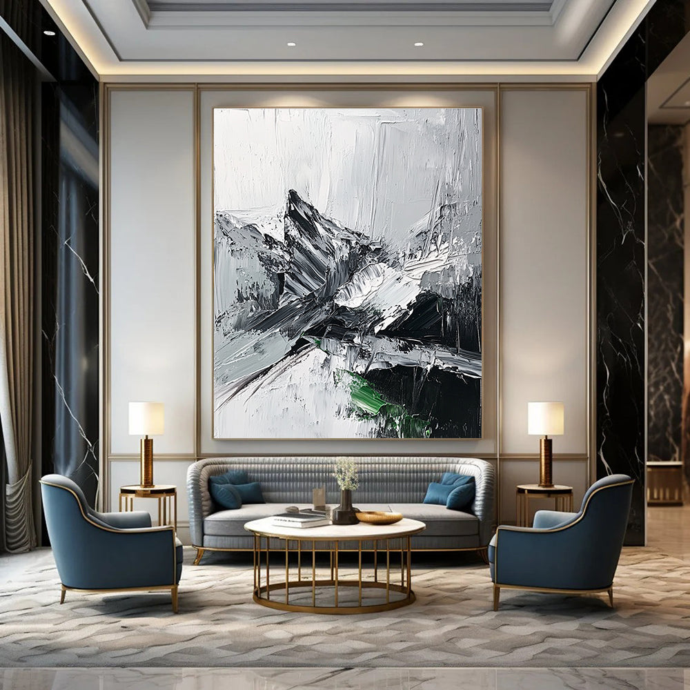 Large abstract painting featuring impasto technique with thick black and white strokes depicting a misty mountain range and a small patch of snow.STSC427