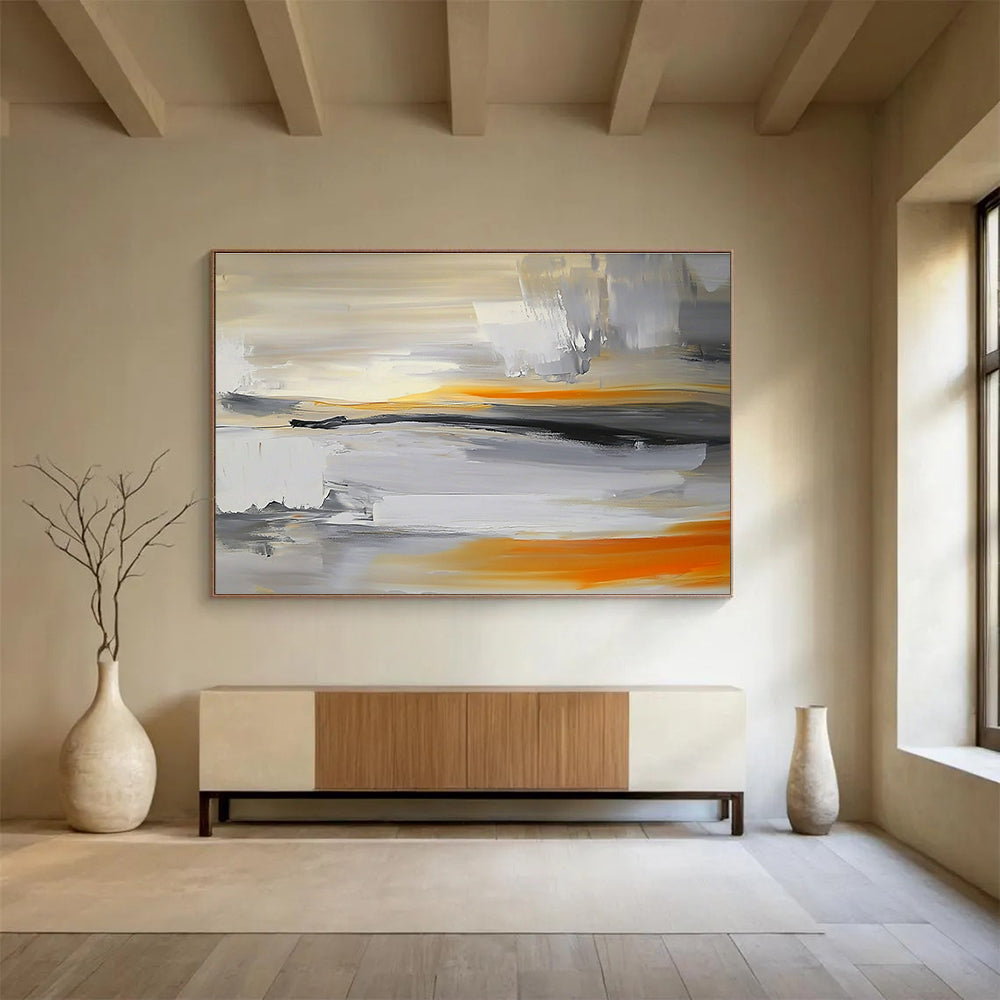 Large abstract painting featuring a grey, white, and orange sky with a blurred horizon and rocks below in a minimalist style.SC175