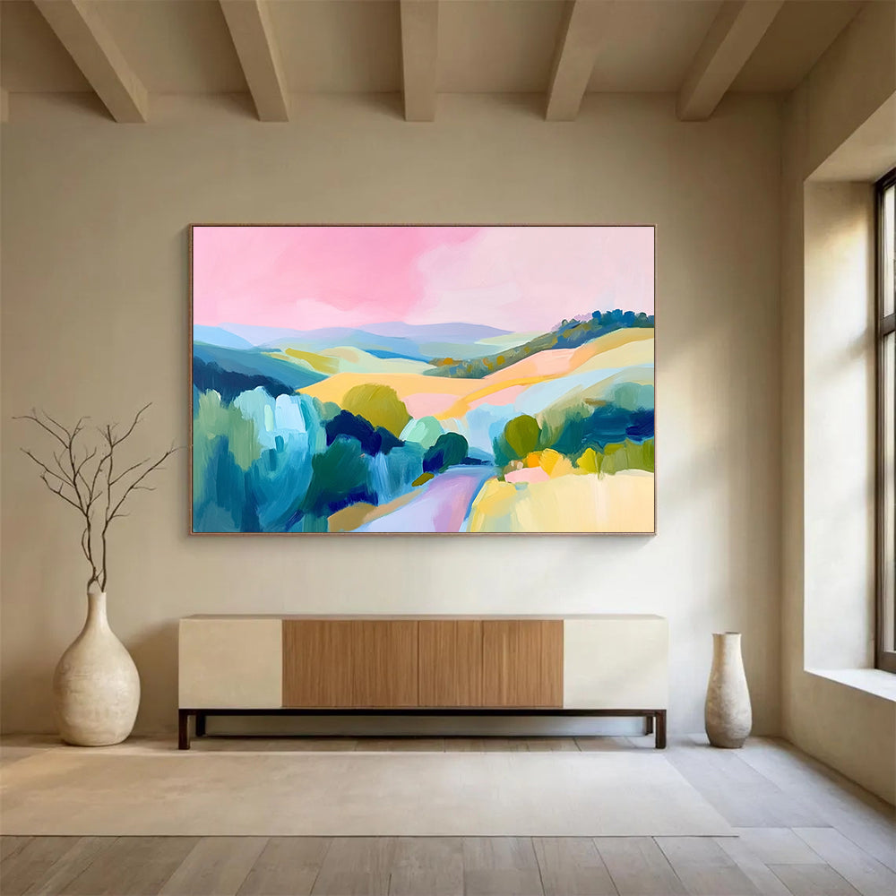 Large abstract painting of the French countryside featuring rolling hills a pink sky and vibrant blue green and yellow brush strokes.SC129