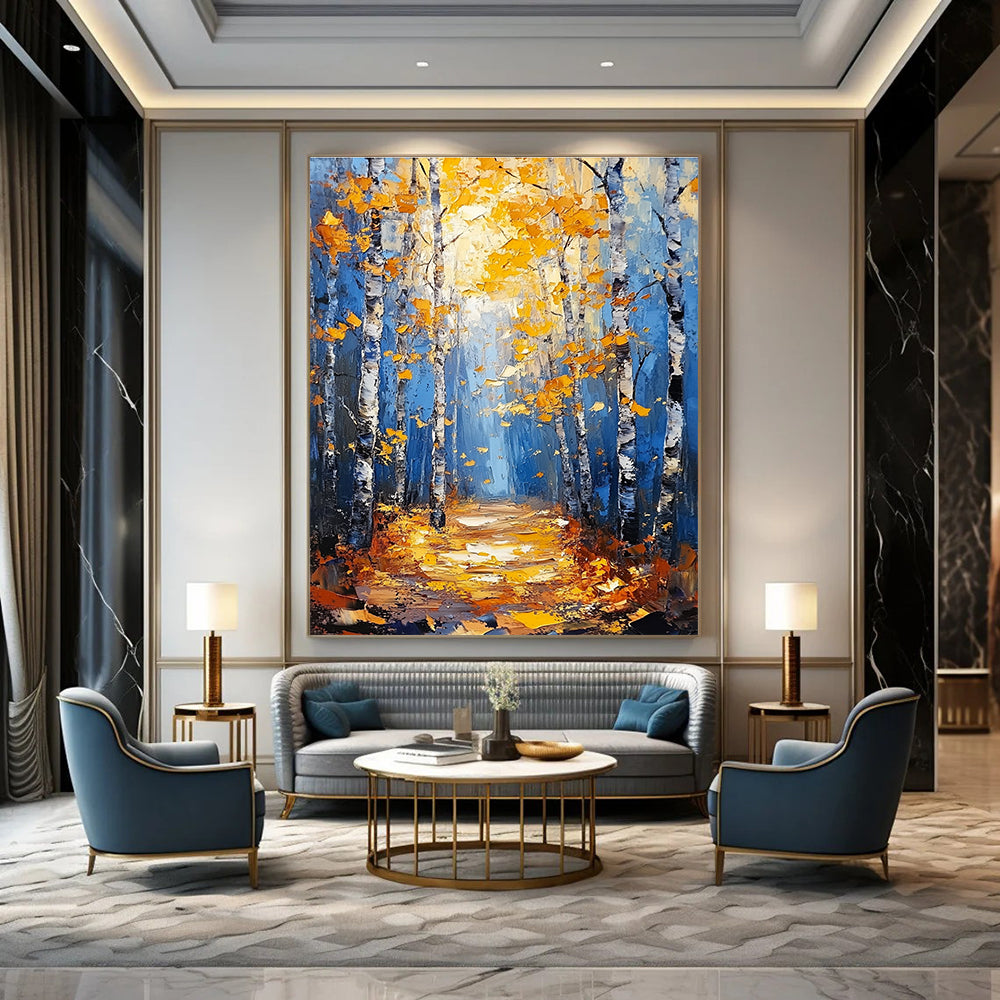 Large abstract painting of birch trees in autumn featuring blue and gold tones with textured background and tranquil atmosphere of sunlight filtering through branches.STSC870
