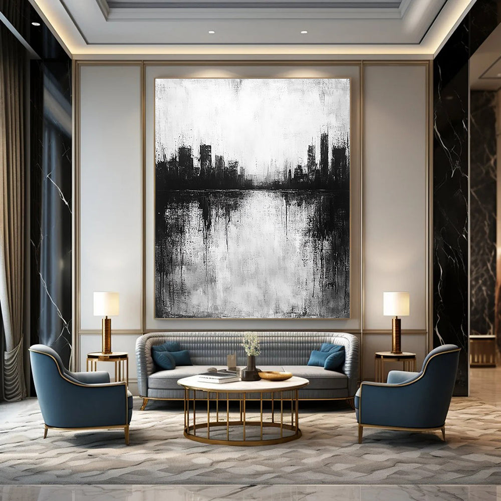 Large abstract painting in black and white with city silhouette and lake reflection evokes calmness and mystery through minimalist heavy brushstrokes.STSC215