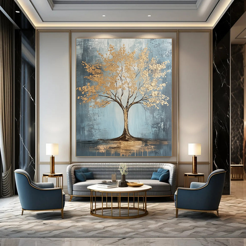 Large abstract painting with gold leaf accents on grey and light blue textured canvas featuring dynamic brush strokes and warm lighting, embodying sophisticated bohemian style.STSC493