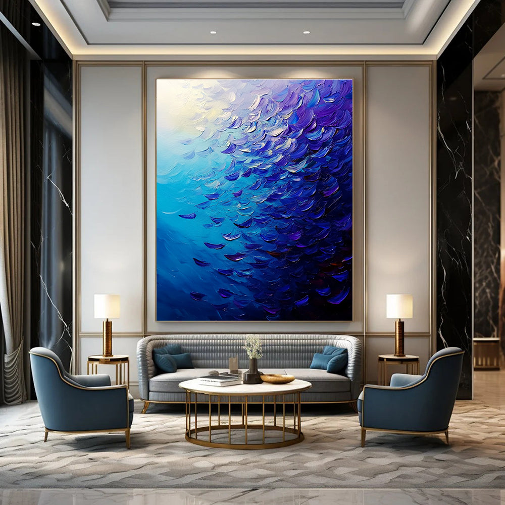 Large abstract painting of a vibrant ocean filled with fish in deep blue and purple hues featuring dynamic brush strokes and rich impasto texture.STSC866