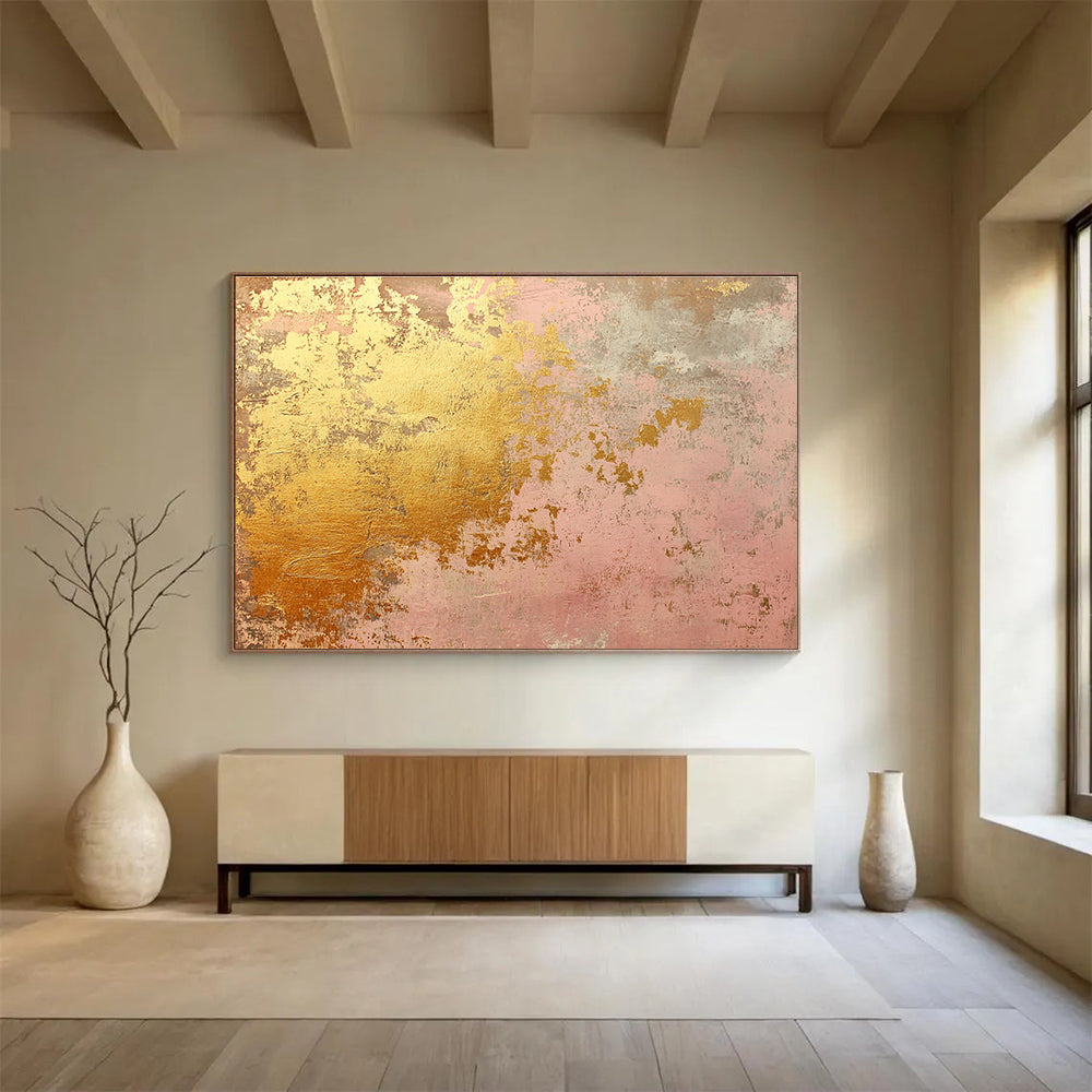 A large abstract canvas in soft pink and gold tones evokes rustic charm with weathered texture and hints of rust, ideal for home decor.SC480