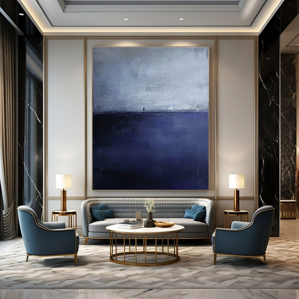Large abstract painting in dark blue and gray depicting an atmospheric seascape with a small silhouette on the distant horizon.STSC1085