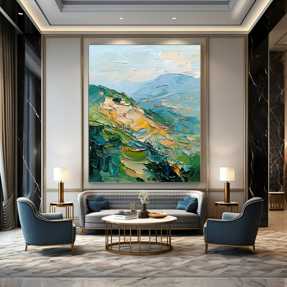 Large abstract painting of mountains featuring palette knife texture and thick brush strokes in a blend of greens blues and golds.STSC192