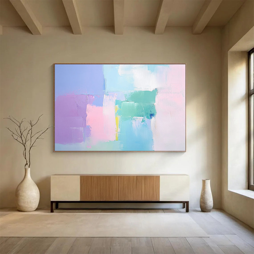 Large abstract painting with soft pastel colors thick brush strokes and a minimalist impressionist style featuring pink blue and light green tones.SC255