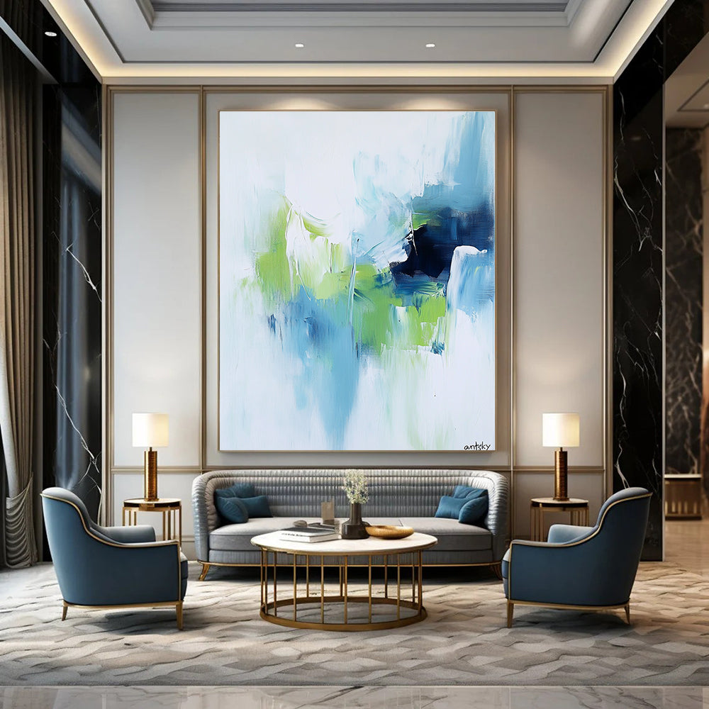 Large abstract painting featuring white blue and green tones with antsky in the lower right corner.STSC826