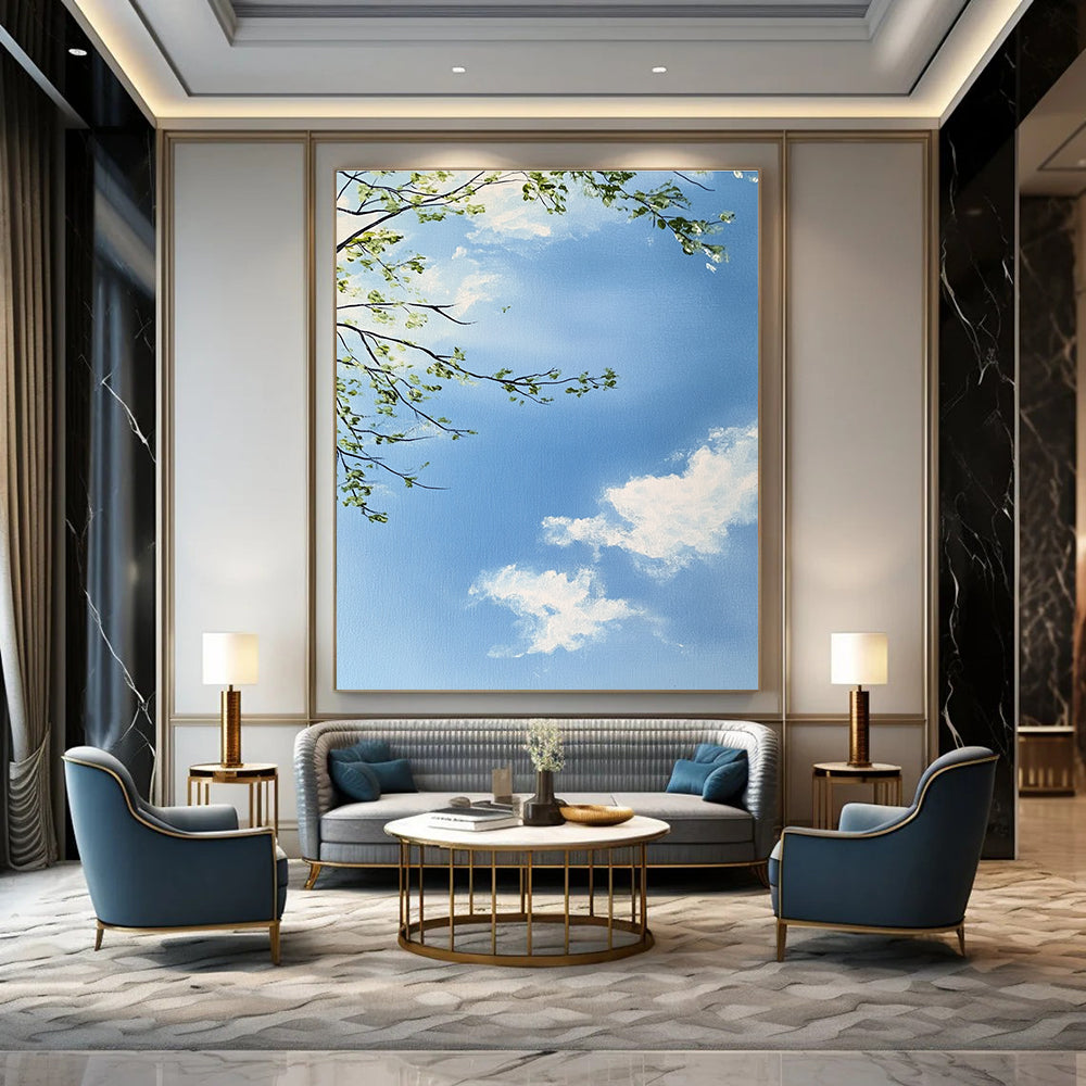 A large abstract painting capturing a serene sky with branches and leaves featuring delicate brushstrokes and soft colors for a tranquil atmosphere.STSC1195