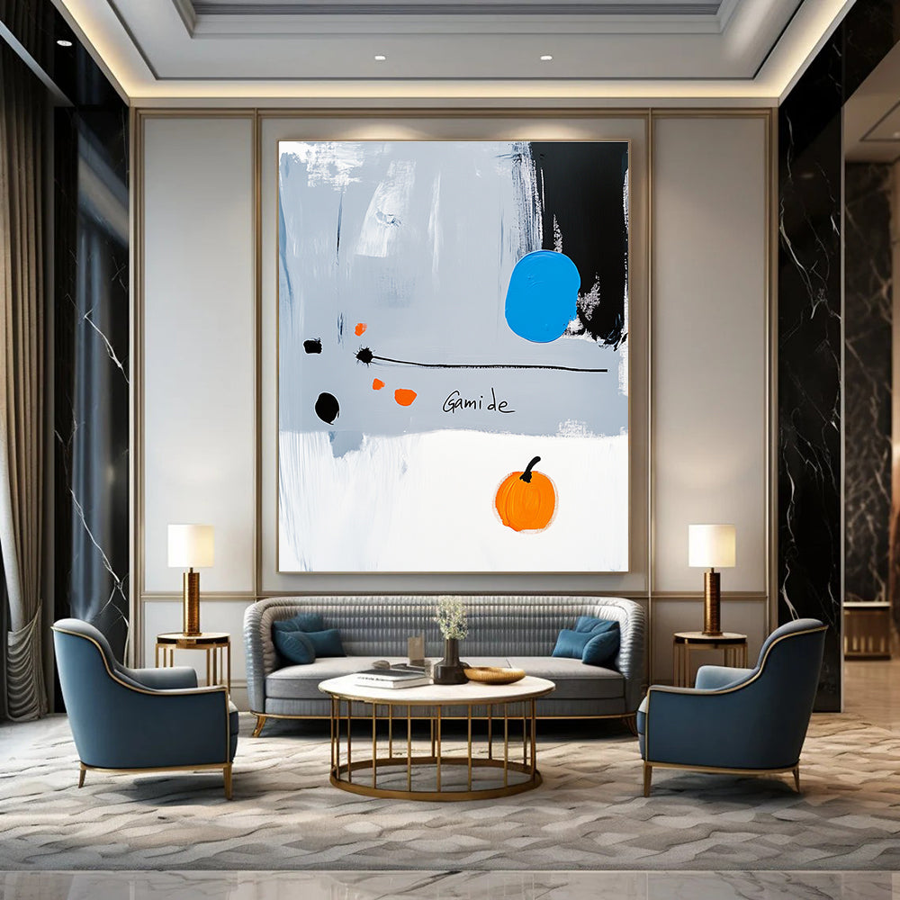 Abstract painting of a right-pointing arrow in blue white gray orange and black with Gamide text and a cartoonish pumpkin on light gray background.STSC1073