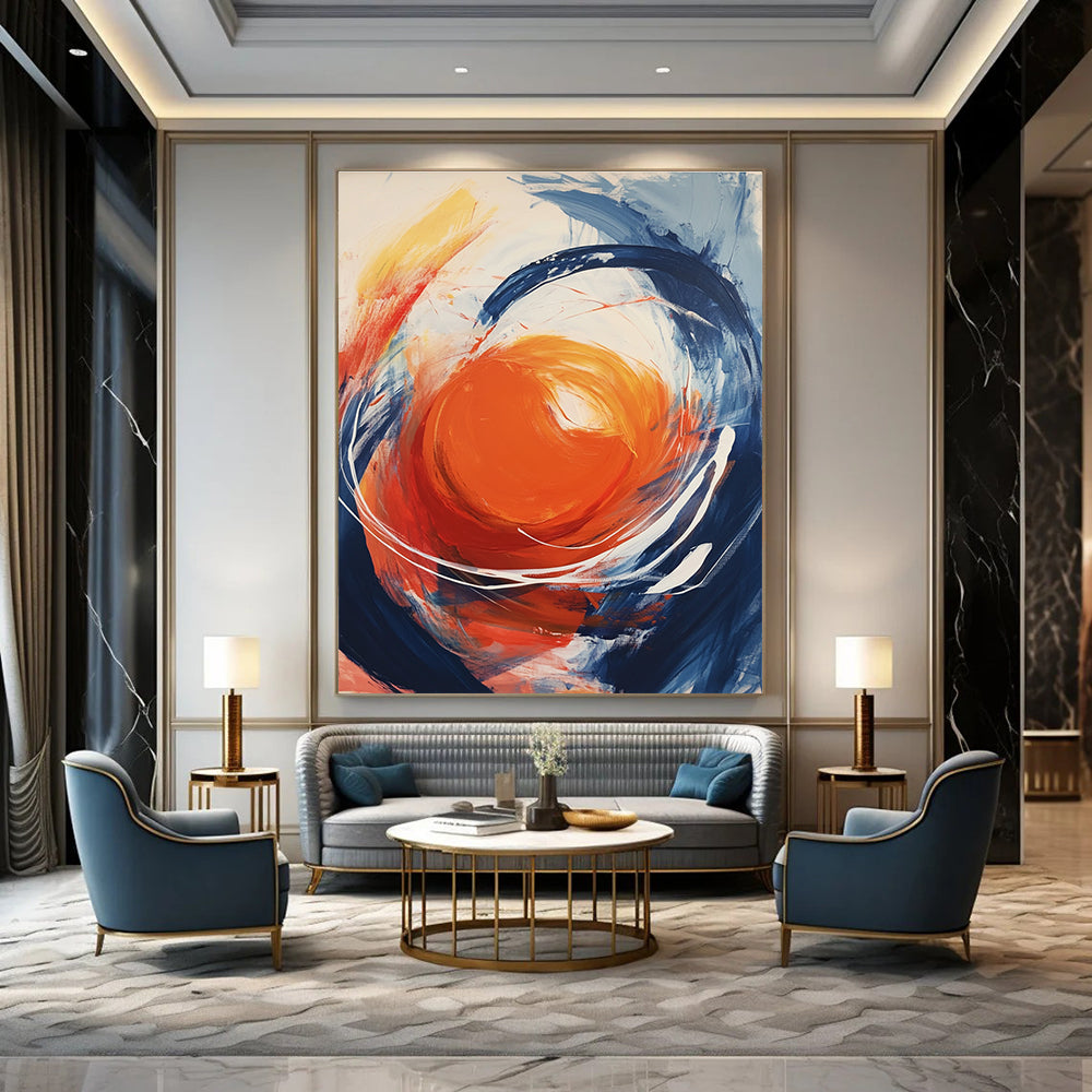 Large abstract painting featuring an orange orb with swirling white energy against a light gray background showcasing vibrant colors and dynamic brushstrokes.STSC744