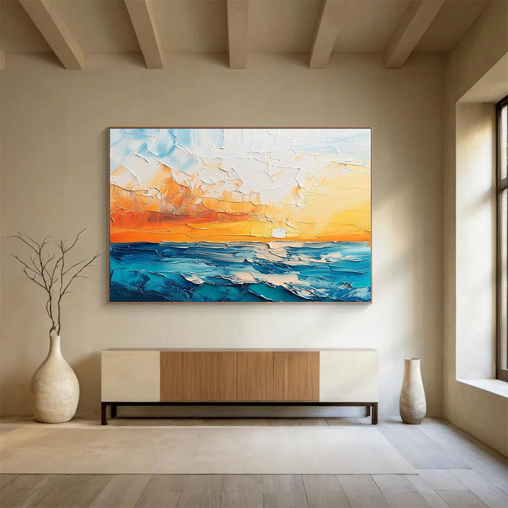 Large abstract painting featuring a textured sunset over the sea and sky in orange blue white and teal shades.SC132