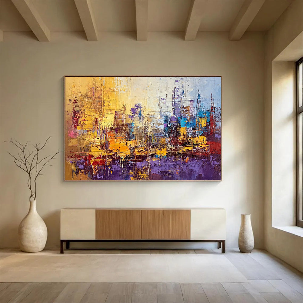 Large abstract painting of a vibrant cityscape in textured gold blue purple and red with impasto strokes and palette knife techniques.SC355