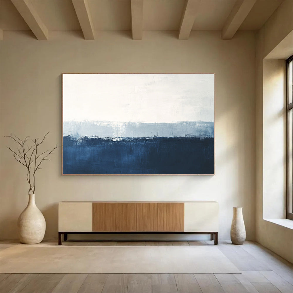 Large abstract painting in calming blue and white with subtle textures tranquil sea view soft edges and atmospheric skies.SC027