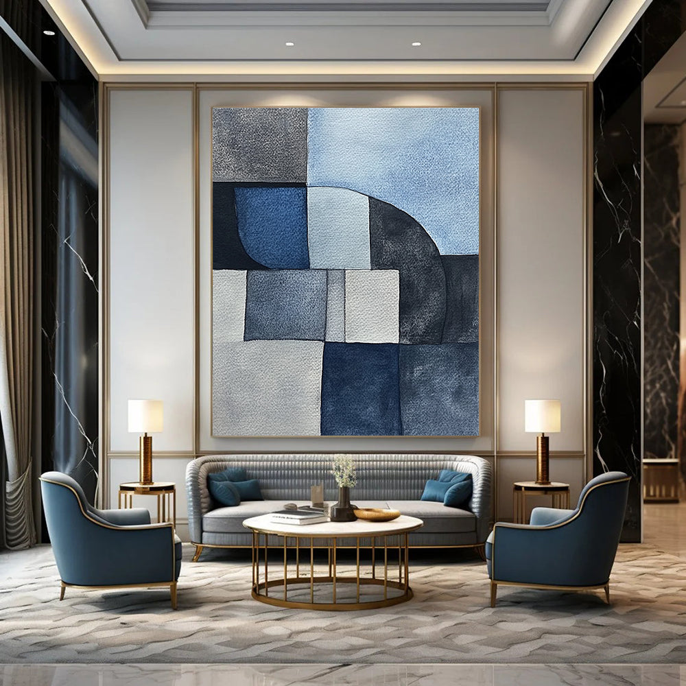 Large abstract painting features minimalistic gray-blue watercolor cubist shapes depicting sandstone rocks in a serene desert landscape.STSC240