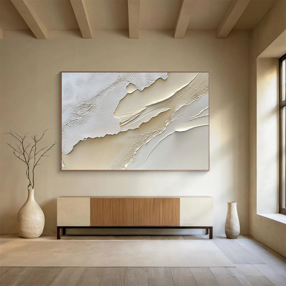 An abstract painting featuring a textured cream-colored surface reminiscent of sand dunes in soft white and beige tones.SC459