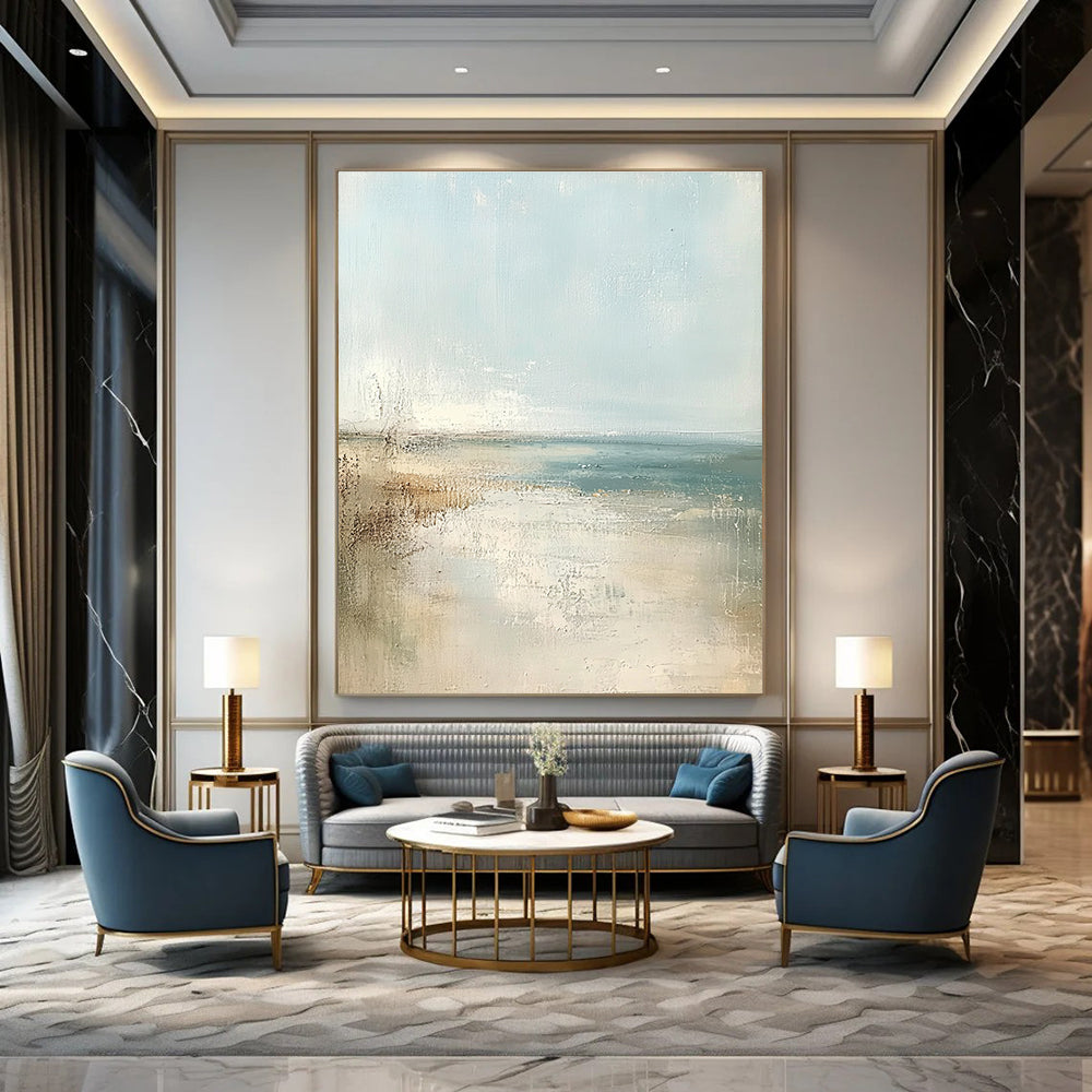 Large abstract painting of a beach in soft pastel colors featuring a light blue sky and neutral tones for a serene atmosphere.STSC158