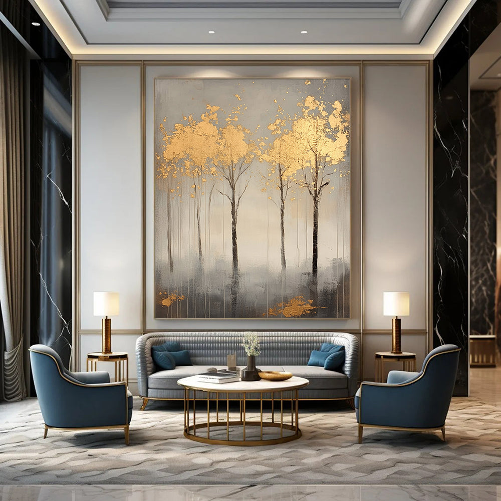 A large abstract painting featuring serene gray trees with gold leaf accents creating a tranquil atmosphere and evoking nature's beauty.STSC1174
