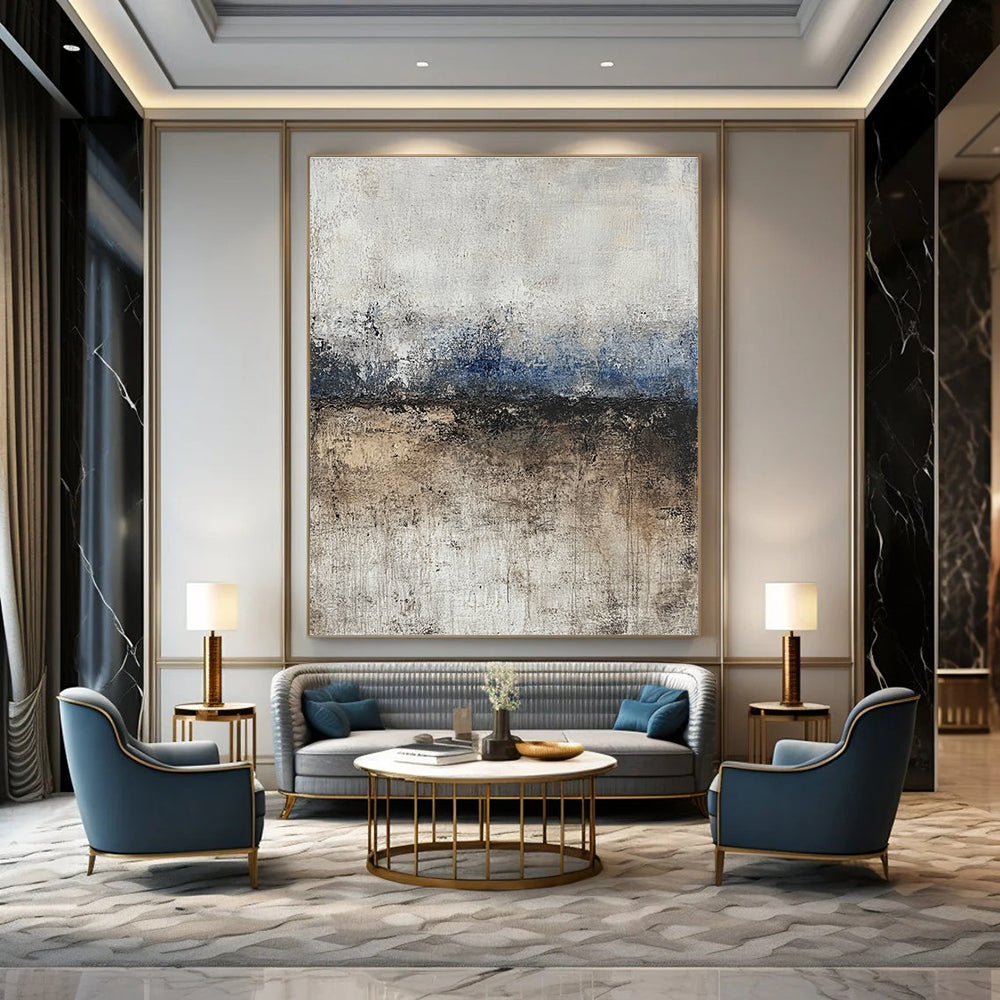 Large abstract painting featuring soft edges and subtle color transitions of beige blue-gray and brown with a path leading to tranquil water.STSC125