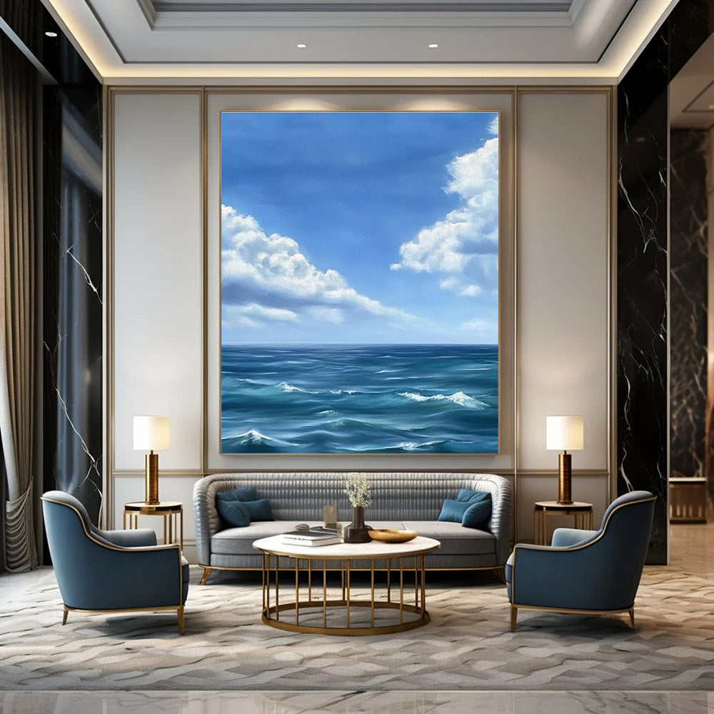 Large abstract painting depicting a tranquil ocean scene with gentle waves under a vast blue sky and soft white clouds in Monet's style.STSC1215