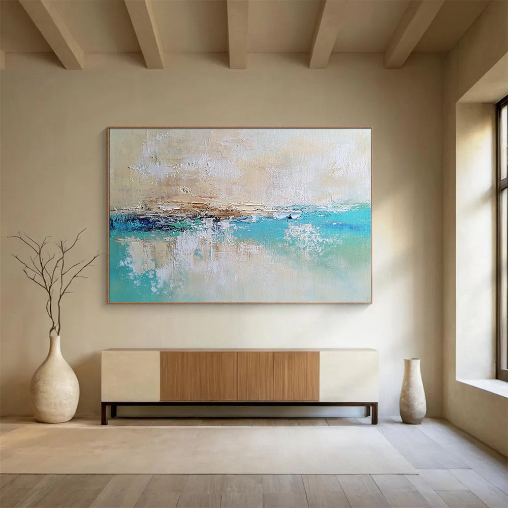 Large abstract painting of a calm sea featuring blue and green tones on a textured canvas with soft edges and neutral colors.SC340