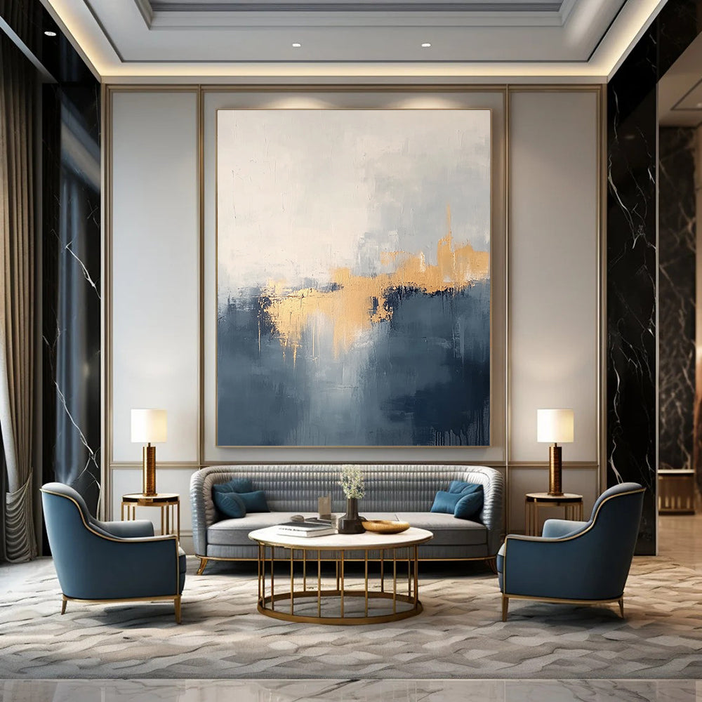 Large abstract painting in grey and blue tones with gold accents creating a dreamy misty atmosphere.STSC731
