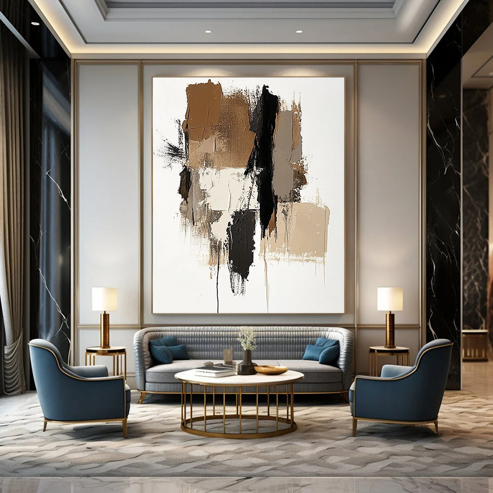 Large abstract painting featuring brown beige and white colors with a prominent gray shape and vertical navy blue detail.STSC677