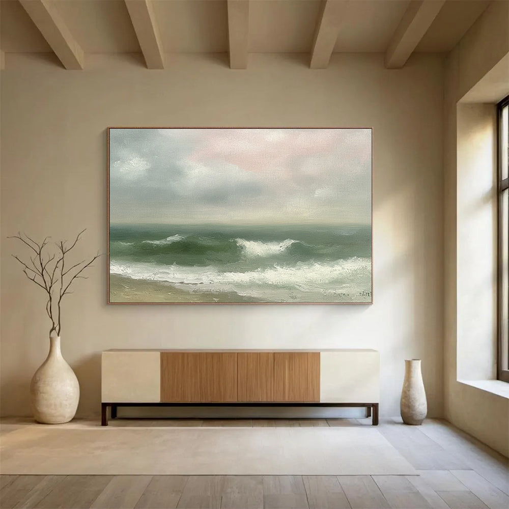 Large abstract painting depicting a vintage seascape with green and gray waves, an empty beach, and a soft pink sky in muted pastels.SC565