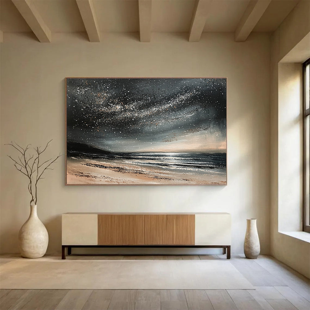 A large abstract painting depicting a calm ocean under a starry night sky with gentle waves and muted gray and black tones.SC528