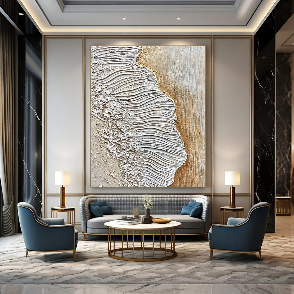 A large abstract painting featuring textured sand and waves in white and beige against an oak wood floor, embodying coastal elegance.STSC946