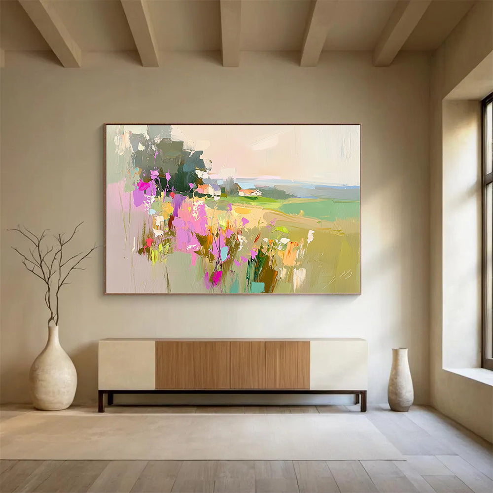 Large abstract painting featuring a floral landscape with fields and a distant cottage in soothing pink purple green and blue tones.SC110