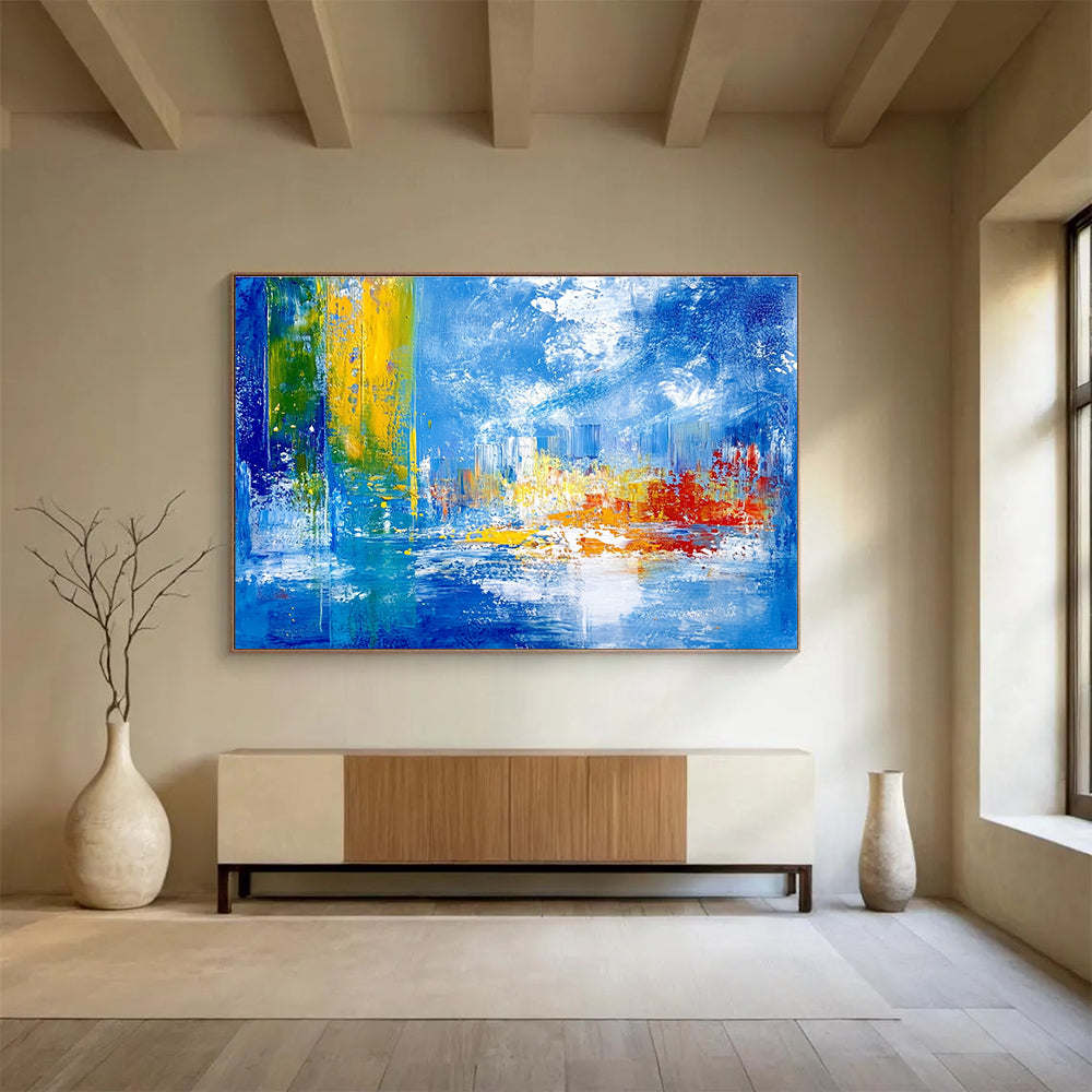 Bold abstract painting with vibrant teal yellow and red colors depicting an underwater city under sea ice against a blue sky and cloud backdrop.SC028