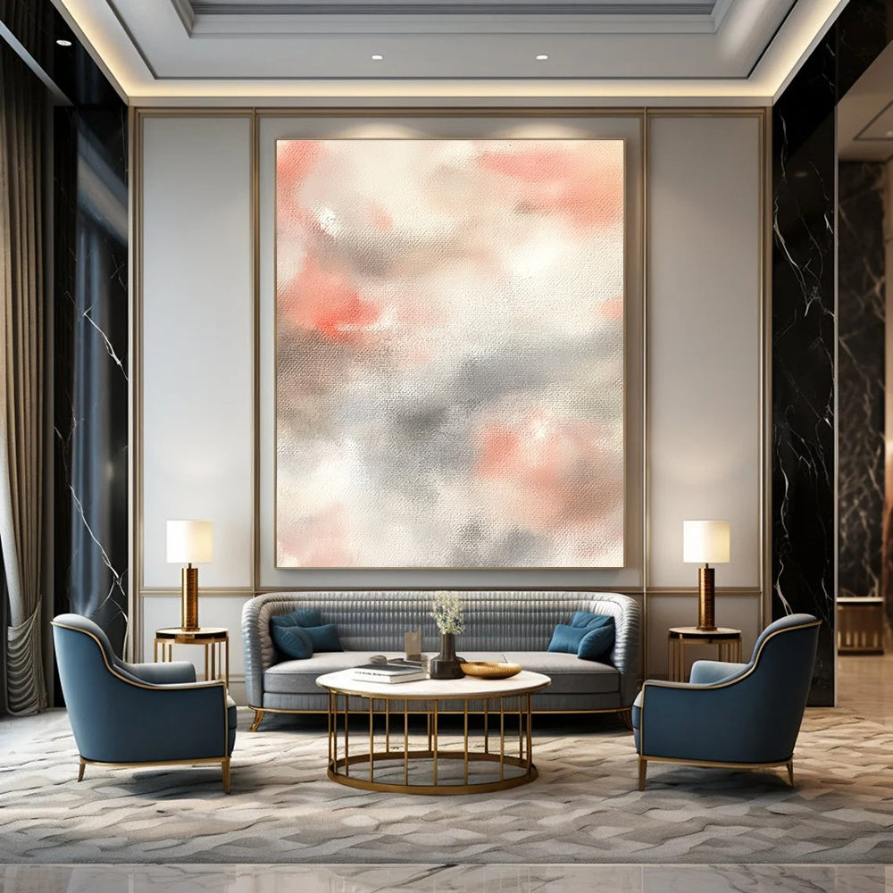 Large abstract painting featuring soft pinks whites and light gray clouds on a beige background creating a serene atmosphere.STSC1462