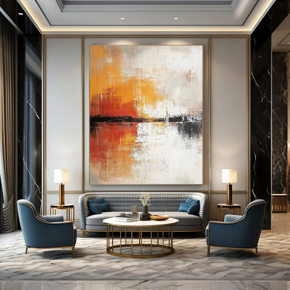 Large abstract painting in soft white and grey tones with warm orange and yellow accents featuring expressive brush strokes and rich texture.STSC813