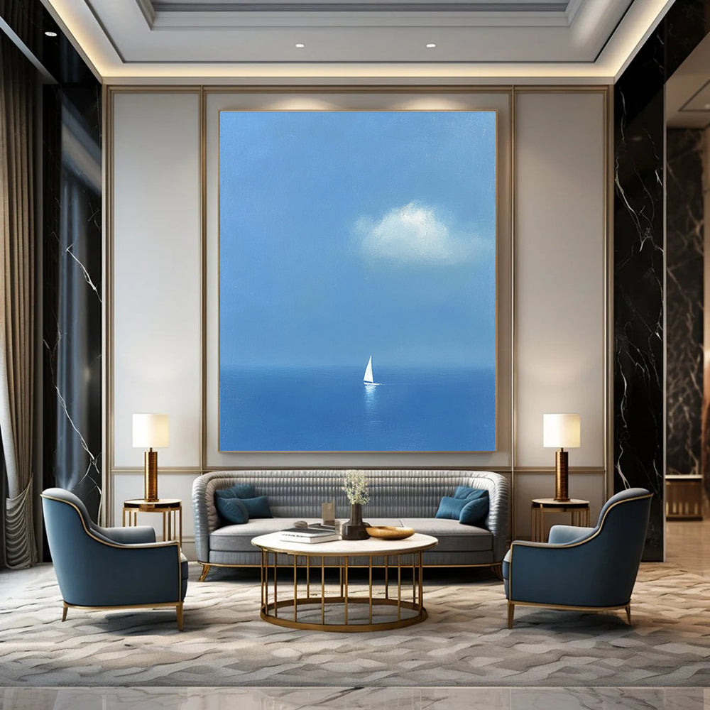 Large abstract painting featuring a white sailboat on the sea in light blue and indigo colors creating a dreamy atmosphere with ethereal clouds.STSC1255