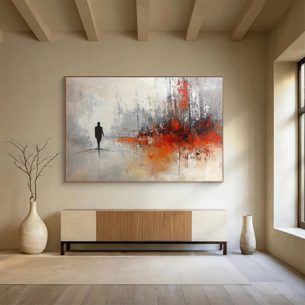 Large abstract painting in soft gray and white tones with red and orange splashes featuring a silhouette in an ominous landscape.SC258