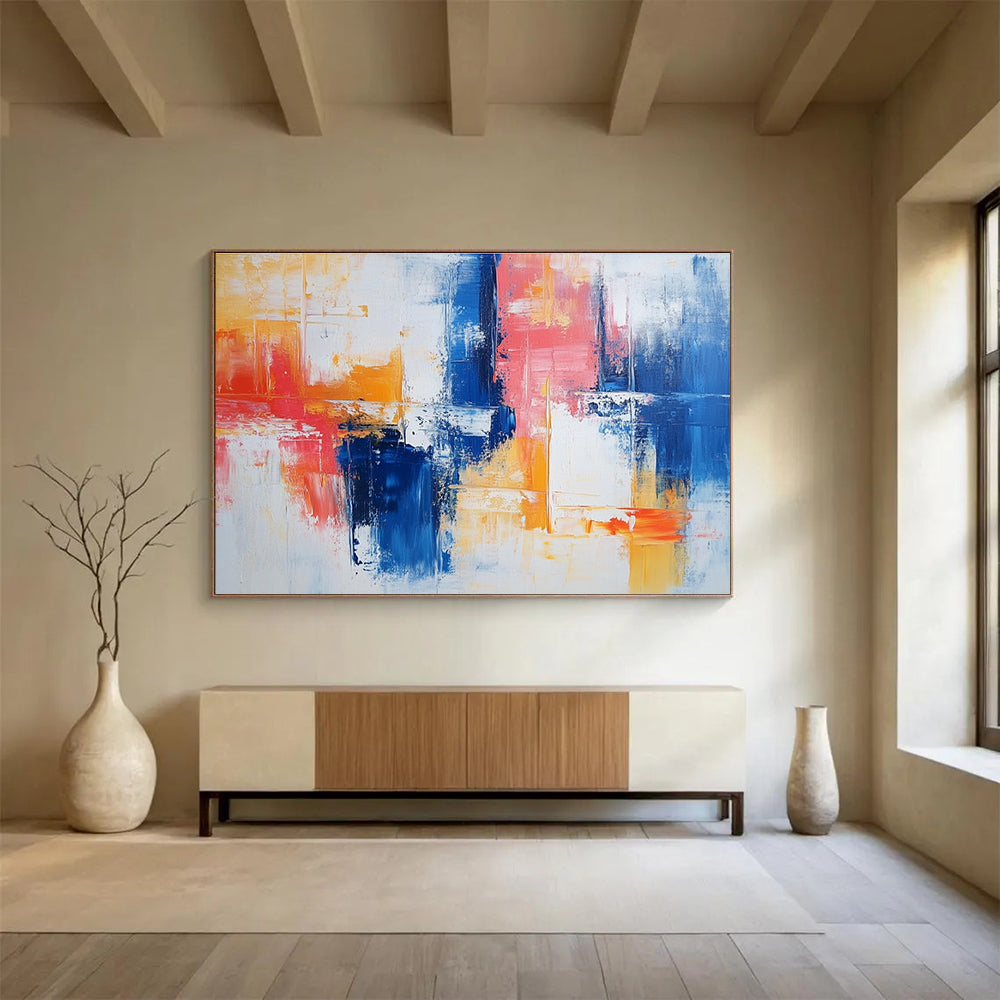 Large abstract painting with vibrant blue and red brush strokes on white, featuring yellow highlights and textured layers that evoke nostalgia and joy.SC263