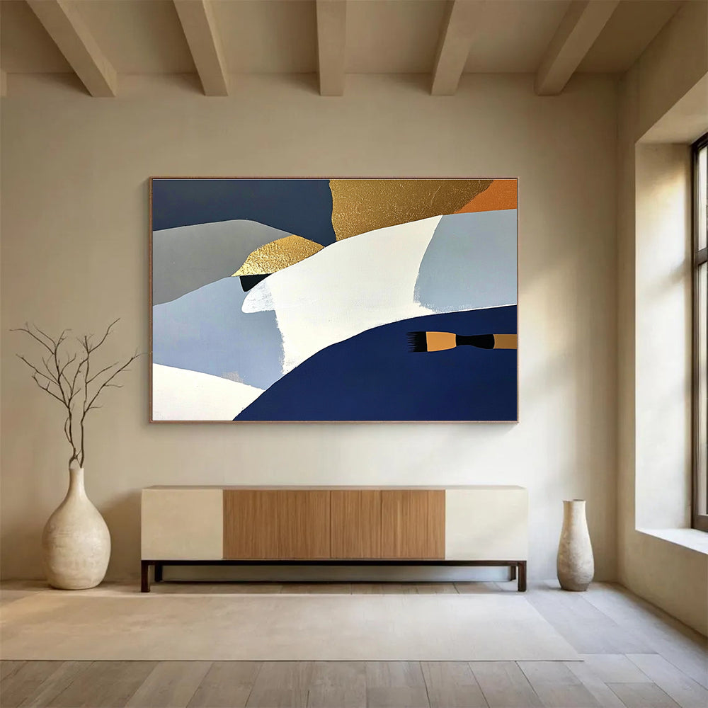 Large abstract painting featuring white blue and gold shapes against a dark gray backdrop with orange details and a soft yellow surface.SC444