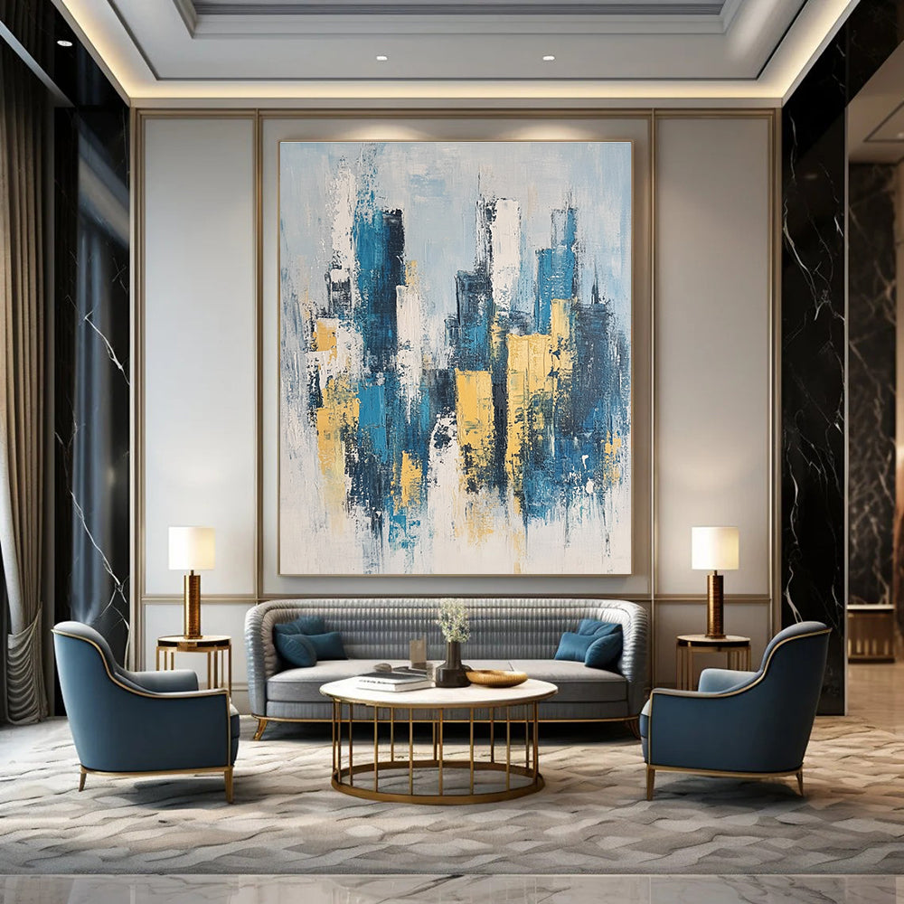 Large abstract painting featuring a modern cityscape in neutral blue and gray tones with yellow accents inspired by impressionist style.STSC1358
