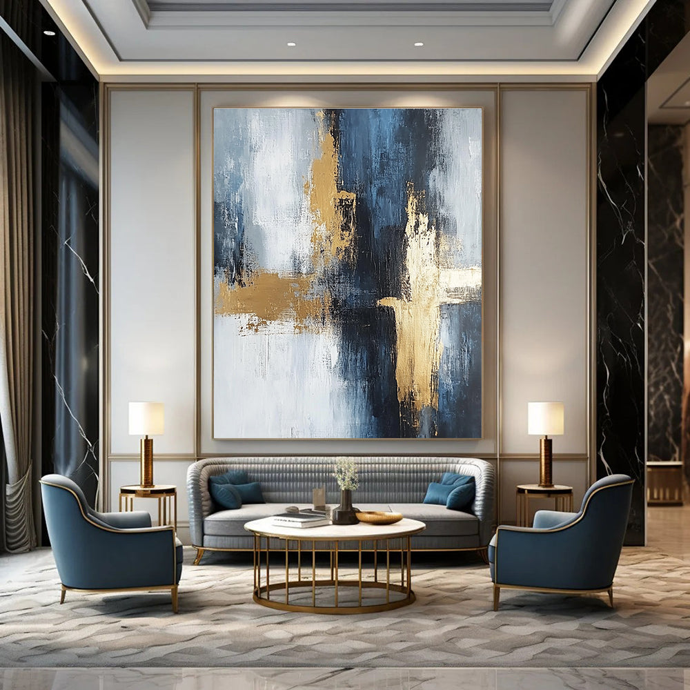 Large abstract painting in light gray and dark blue tones with gold accents featuring strong brushstrokes and delicate textures creating spatial depth.STSC433