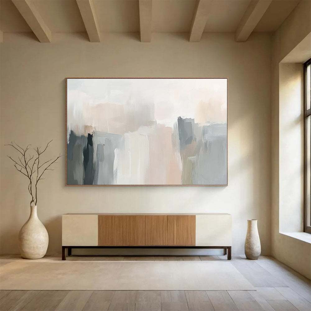 Large abstract painting in soft neutral tones with gentle brushstrokes and subtle color transitions creating an elegant atmosphere.SC058