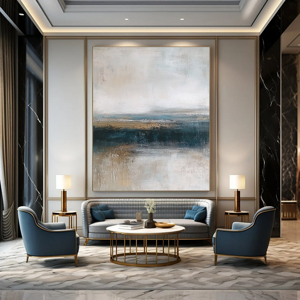 Large abstract painting depicting textured ocean waves in blue and gray with a soft beige sky and earthy shore tones for a tranquil ambiance.STSC463